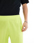 The North Face logo pocket shorts in lime