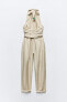 Jumpsuit with belt and beads