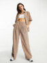 Фото #1 товара ASOS DESIGN drapey wide leg trousers in baby cord brown co-ord