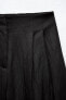 Loose fit pleated trousers