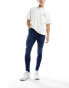 ASOS DESIGN spray on jeans with power-stretch in mid wash blue