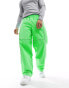 The North Face Tek woven joggers with reflective piping in bright green