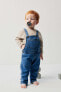 Denim dungarees with pocket