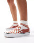 Vans classic slip on trainers in burnt orange and white checkerboard