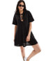 Фото #1 товара ASOS DESIGN waffle tie front smock mini dress in black