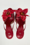 High-heel sandals with floral detail