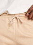 ASOS DESIGN slim shorts in beige quilted texture