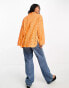 ASOS DESIGN relaxed broderie shirt with dipped hem in orange