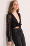 Фото #7 товара Женская блузка с длинным ажурным рукавом и завязанным бюстье - черная Factory Price