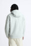 Hooded technical jacket