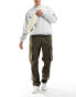 Фото #1 товара ASOS DESIGN baggy cargo trousers in ripstop with elasticated waist in Khaki