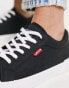 Levi's Malibu trainer in black with red tab logo