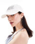 Weekday cap with silver embroidery in white