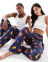 ASOS DESIGN Disney lounge bottoms with Lion King print in navy