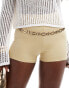 ASOS DESIGN disco micro shorts in gold