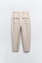 Carrot-fit trousers with darted hems