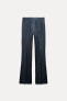 FLARE-LEG DENIM-LOOK TROUSERS