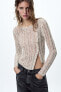 Asymmetric open-knit sweater