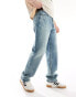 ASOS DESIGN straight leg jeans with stretch in mid wash blue