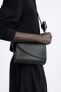 Crossbody bag with asymmetric flap