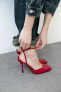 Shiny heeled shoes