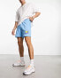 ASOS DESIGN oversized shorts in blue with cartoon print