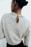 Knit sweater with rhinestone neck
