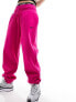 Nike mini swoosh oversized fleece joggers in fierce pink