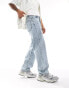 Фото #2 товара ASOS DESIGN baggy fit jeans in light wash blue with heavy acid wash