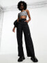 Фото #3 товара Nike mini swoosh high rise woven trousers in black