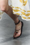 Lace-up leather sandals with beads