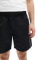 ASOS DESIGN slim nylon shorts with piping detail in black