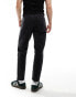 ASOS DESIGN tapered fit jeans with panelling detail in washed black