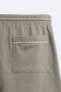 Bermuda shorts with contrast embroidery