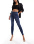 Фото #6 товара Spanx shape and lift distressed skinny jeans in medium wash blue