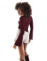 ASOS DESIGN textured asymmetric angel sleeve top in burgundy