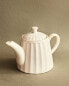 Stoneware teapot with raised design