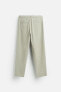 TEXTURED PLEATED TROUSERS