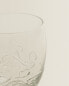 Raised floral design glass tumbler