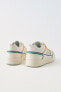 Minimalist lace-up sneakers with multicoloured trim