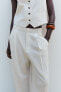 Flowing trousers with pleats