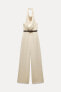 HALTERNECK JUMPSUIT WITH TIE BELT