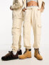 Фото #4 товара Calvin Klein Jeans unisex cargo joggers in beige - exclusive to ASOS