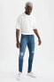 Фото #3 товара Super Skinny Fit Normal Bel Dar Paça Yırtık Detaylı Jean Pantolon