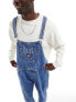 Tommy Jeans denim dungarees in mid wash