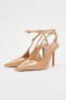 Patent-finish heeled slingback shoes