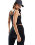 ASOS 4505 soft touch vest top with ruched front and inner bra in black