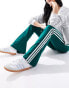 adidas Originals three stripe flared leggings in collegiate green