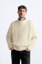 Textured cable-knit sweater