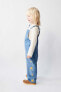 Denim dungarees with daisies